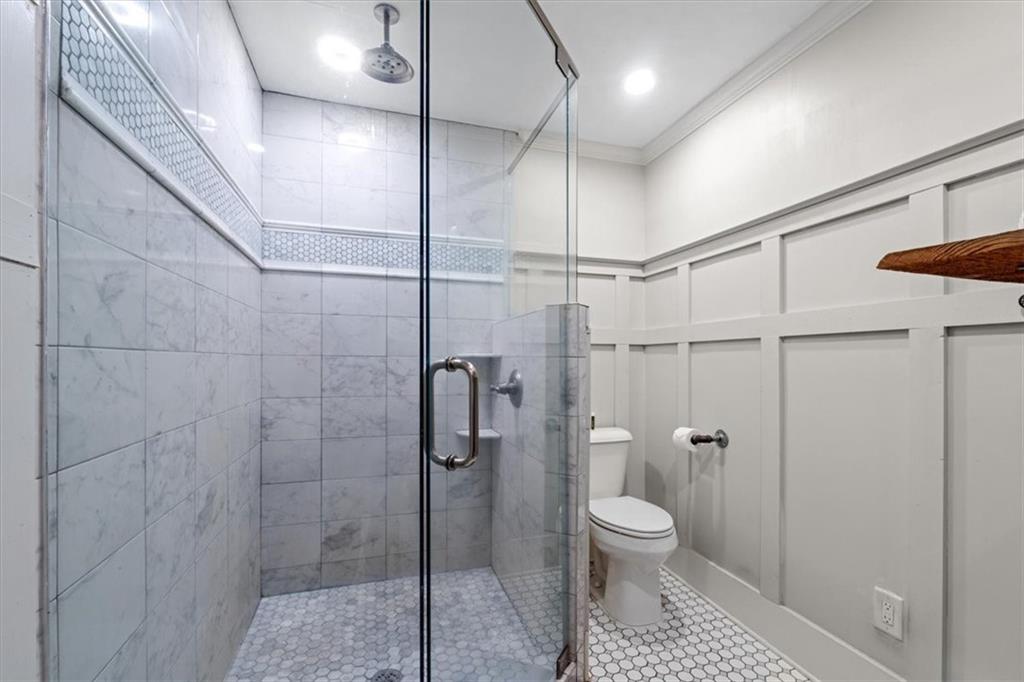 5143 Floyd Street Northeast Covington, GA 30014 - Photo 18 of 27 a bathroom with a toilet and a shower