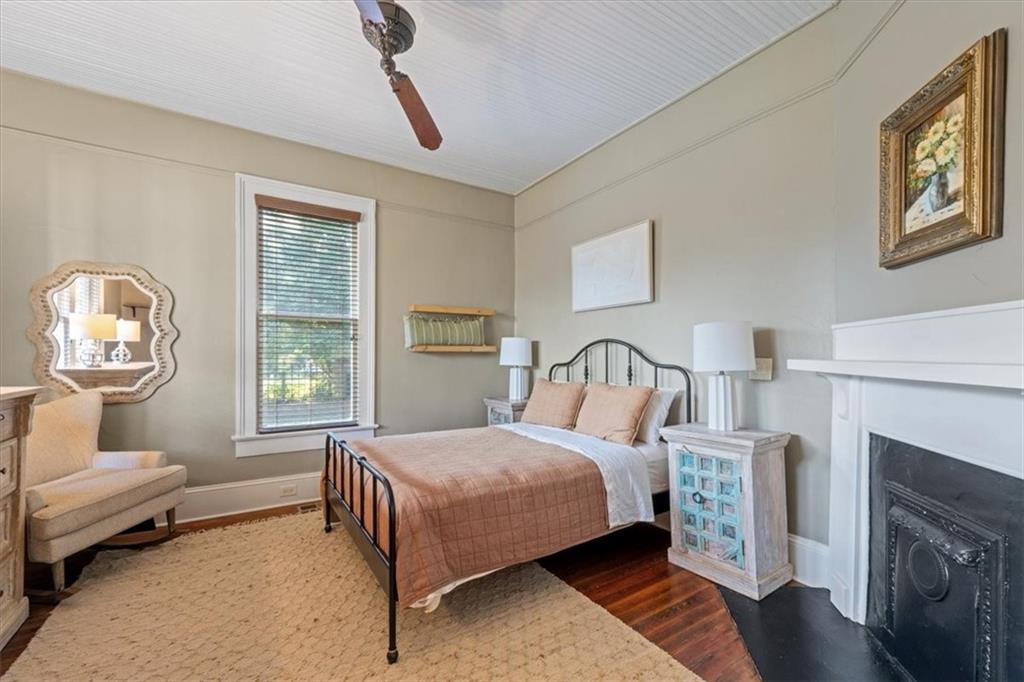 5143 Floyd Street Northeast Covington, GA 30014 - Photo 19 of 27 a bedroom with a bed a table and chair