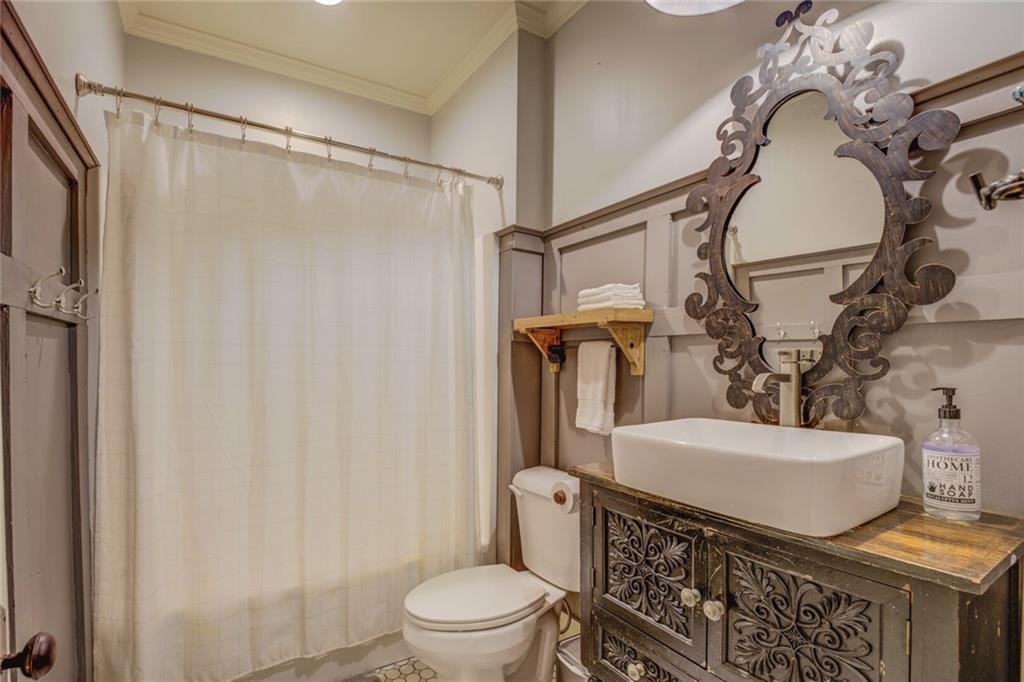 5143 Floyd Street Northeast Covington, GA 30014 - Photo 21 of 27 a bathroom with a toilet and a shower
