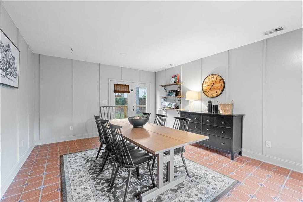 5143 Floyd Street Northeast Covington, GA 30014 - Photo 22 of 27 a view of a dining room that has a table and a chair in it