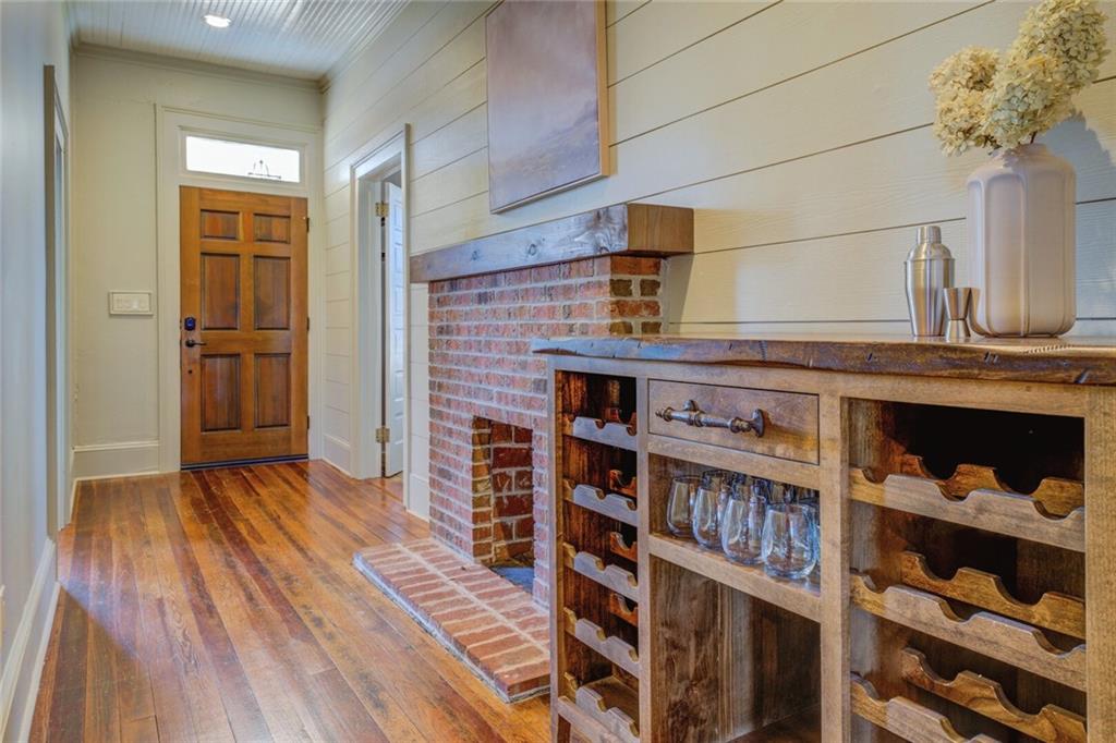 5143 Floyd Street Northeast Covington, GA 30014 - Photo 4 of 27 a view of a kitchen with wooden floor and cabinets