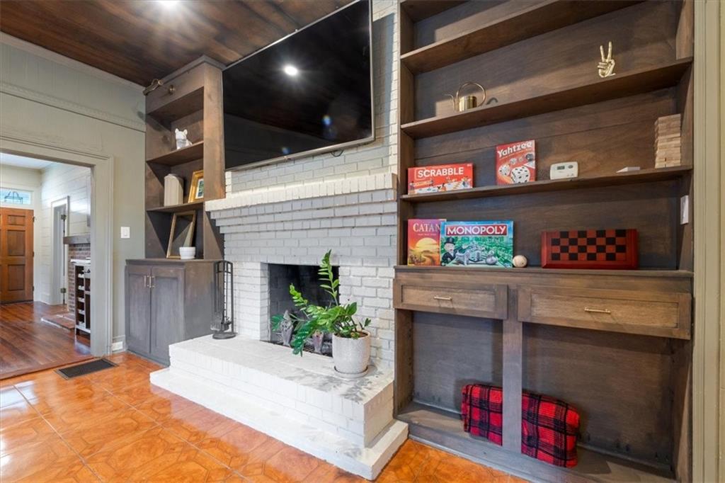 5143 Floyd Street Northeast Covington, GA 30014 - Photo 5 of 27 a living room with fireplace furniture and a flat screen tv