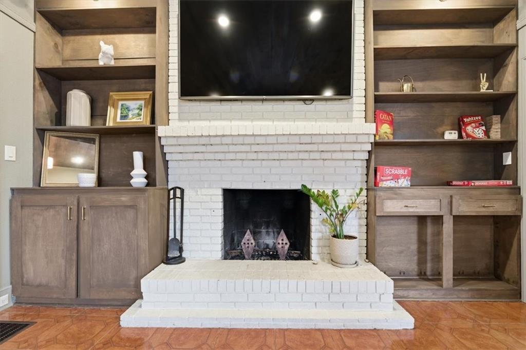 5143 Floyd Street Northeast Covington, GA 30014 - Photo 6 of 27 a room with fireplace and cabinets
