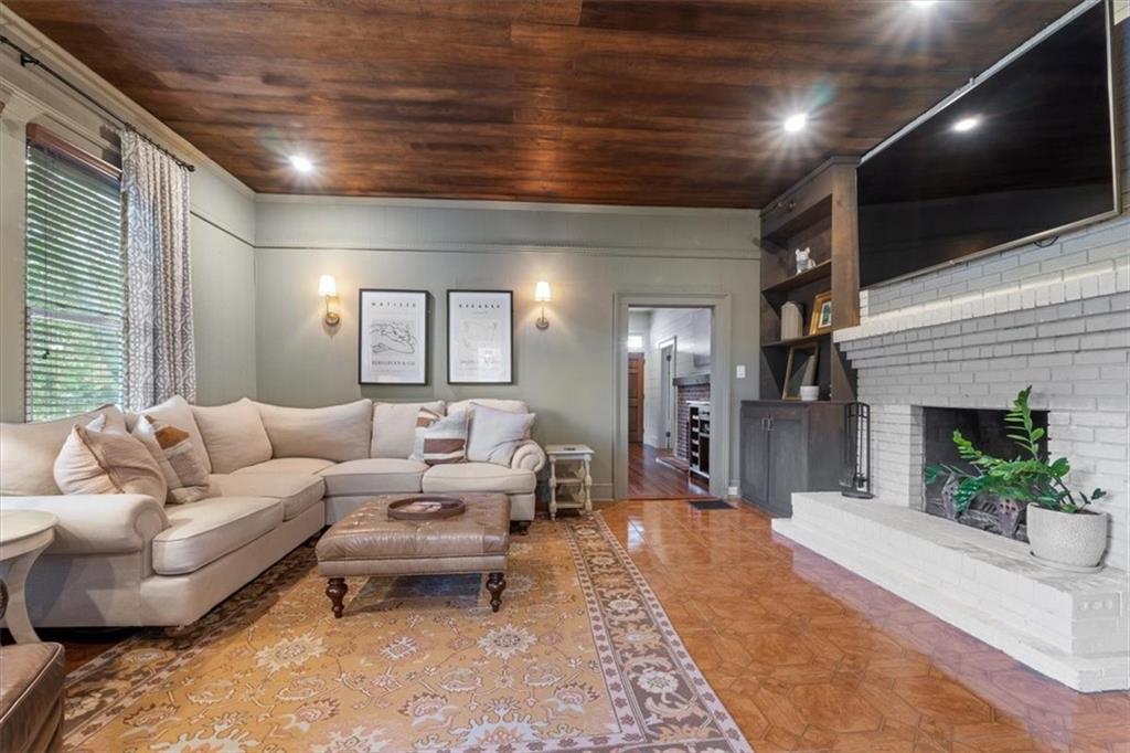 5143 Floyd Street Northeast Covington, GA 30014 - Photo 8 of 27 a living room with furniture and a flat screen tv