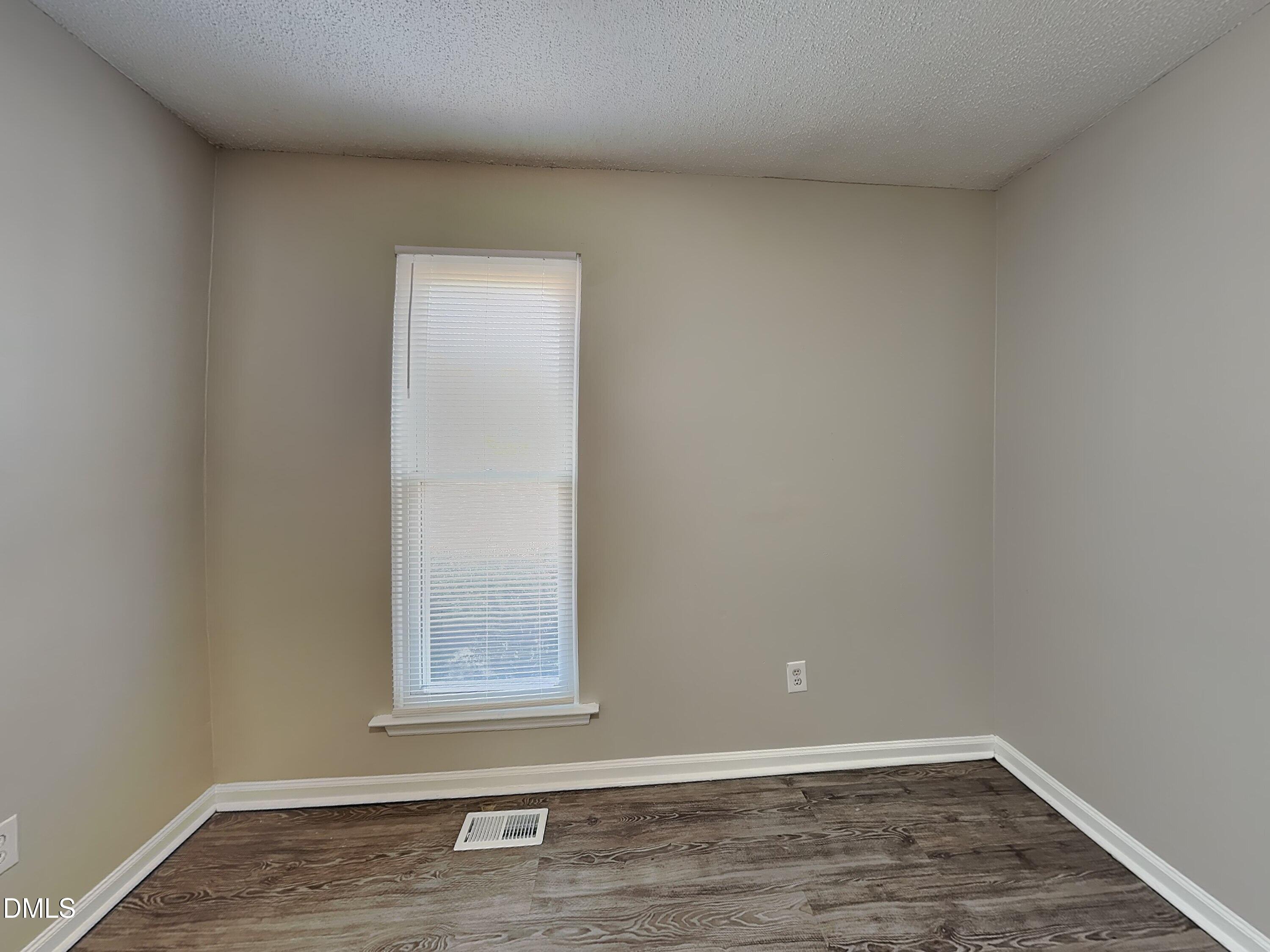 3520 Lytham Place Raleigh, NC 27604 - Photo 12 of 18 a view of a small space with wooden floor and a window