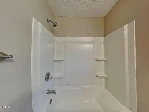 a close view of a bathtub in a bathroom