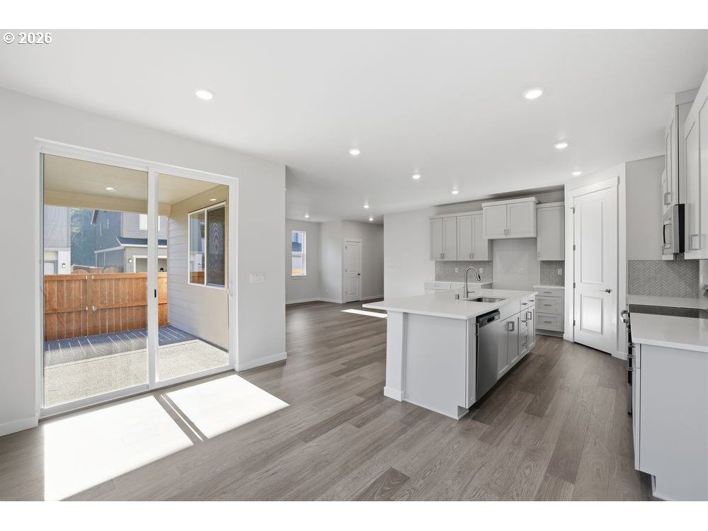 3201 Southwest 4th Avenue Battle Ground, WA 98604 - Photo 12 of 18 a open kitchen with white cabinets and a refrigerator