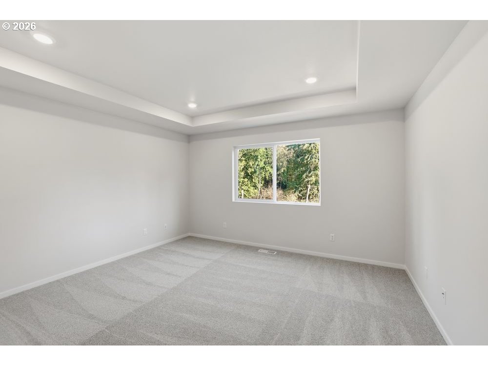 3201 Southwest 4th Avenue Battle Ground, WA 98604 - Photo 15 of 18 an empty room with wooden floor and windows