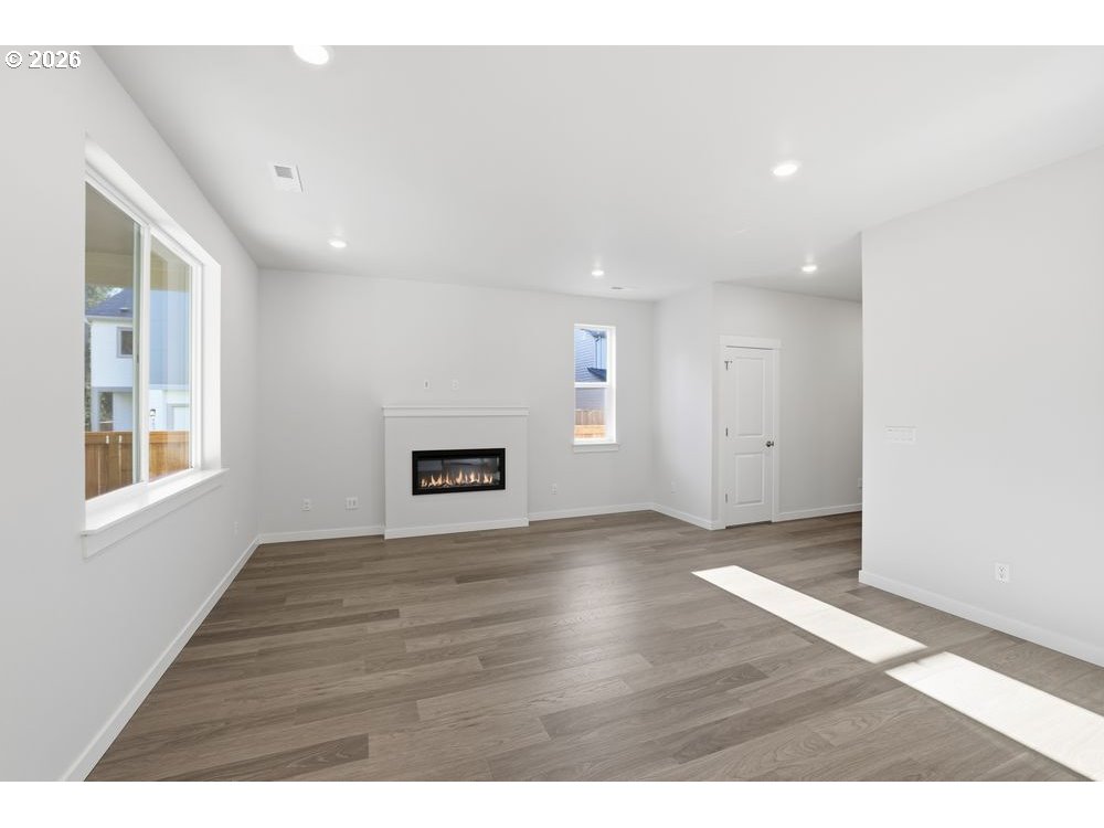 3201 Southwest 4th Avenue Battle Ground, WA 98604 - Photo 17 of 18 a view of an empty room with wooden floor and a window