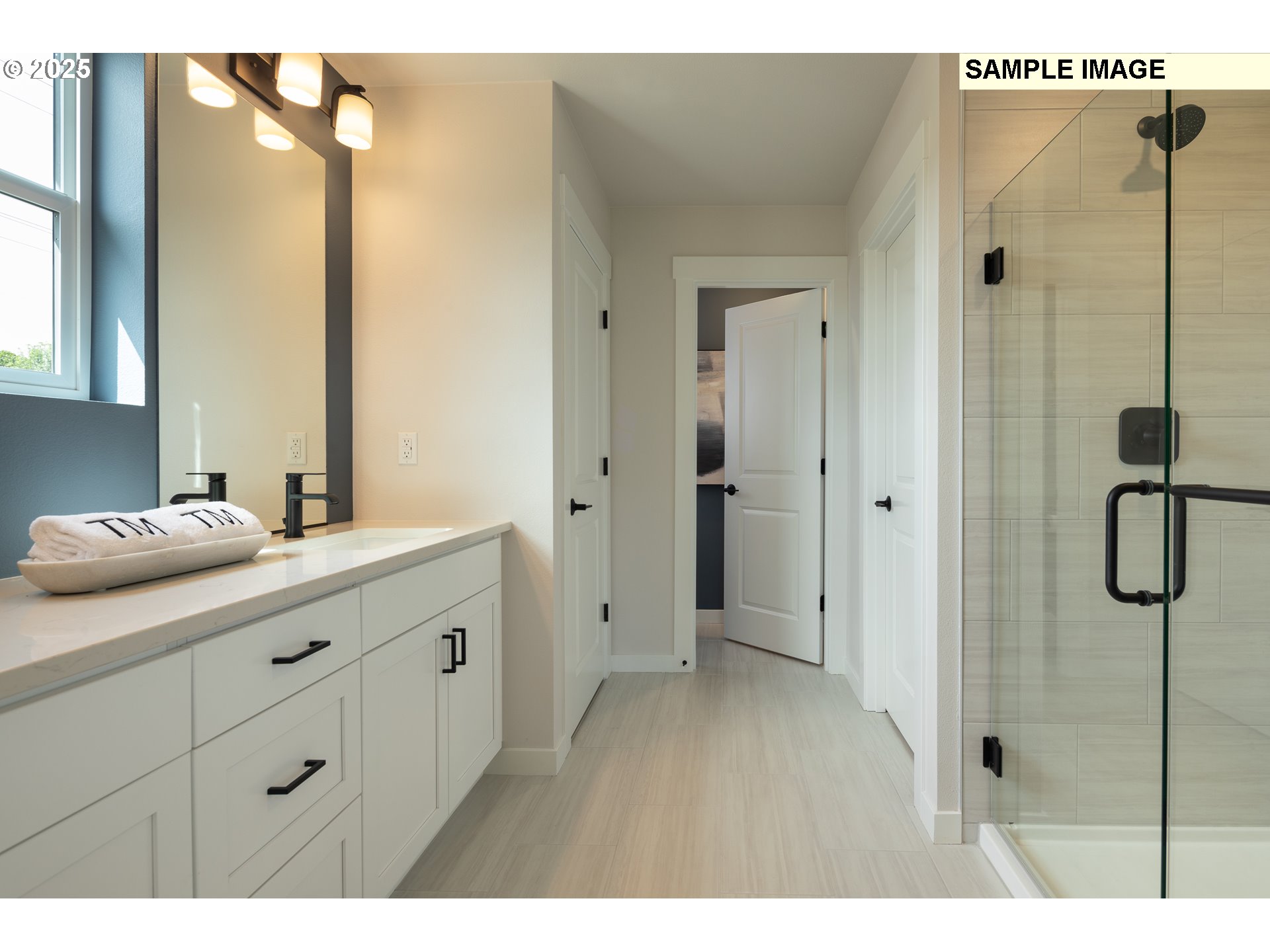 3201 Southwest 4th Avenue Battle Ground, WA 98604 - Photo 9 of 18 a bathroom with a shower sink and mirror