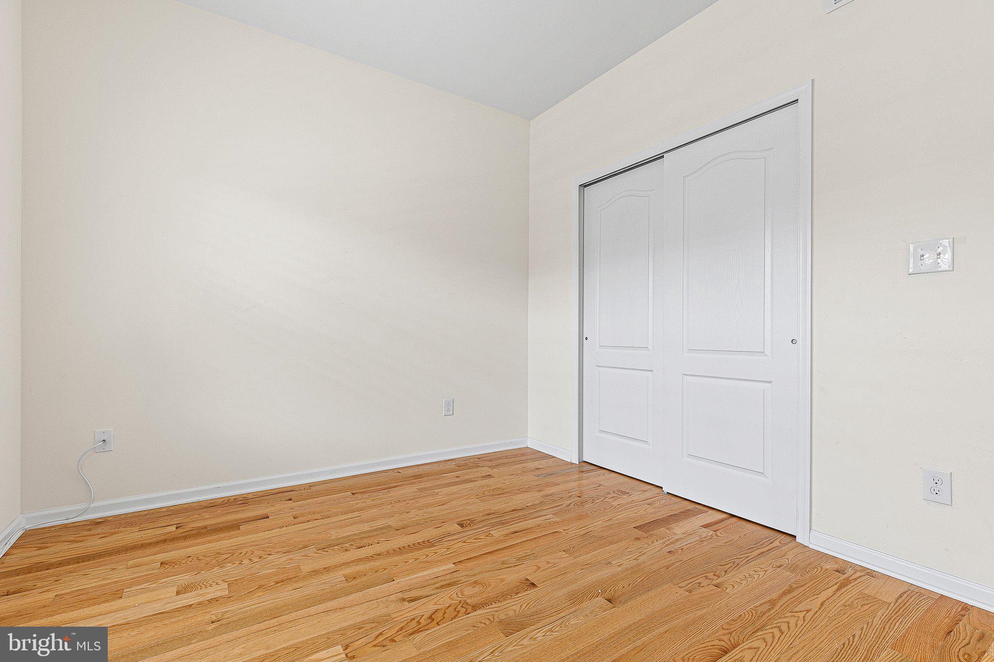 647 Vivaldi Drive Middletown, DE 19709 - Photo 14 of 38 a view of empty room with wooden floor