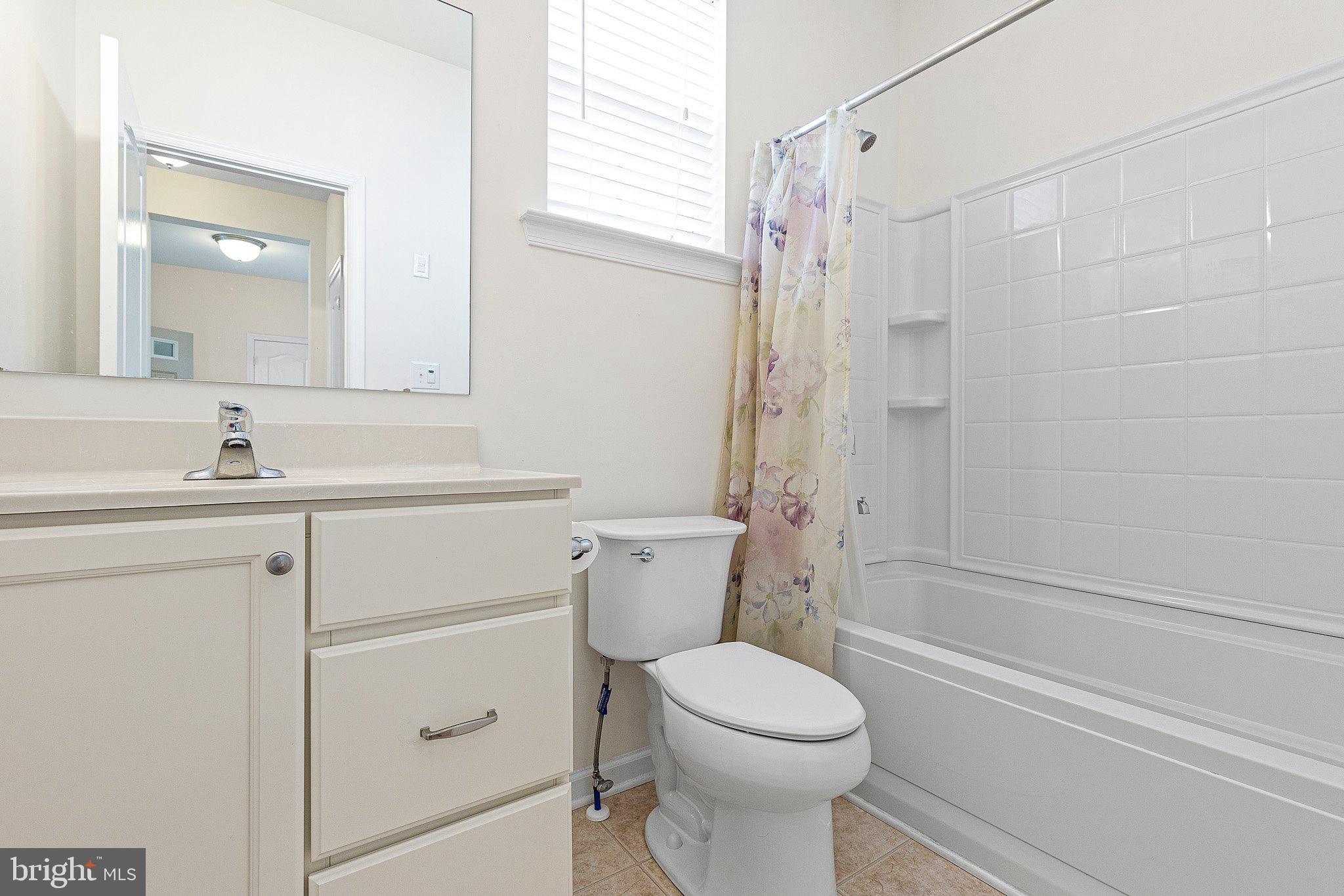 647 Vivaldi Drive Middletown, DE 19709 - Photo 15 of 38 a bathroom with a sink a toilet and shower