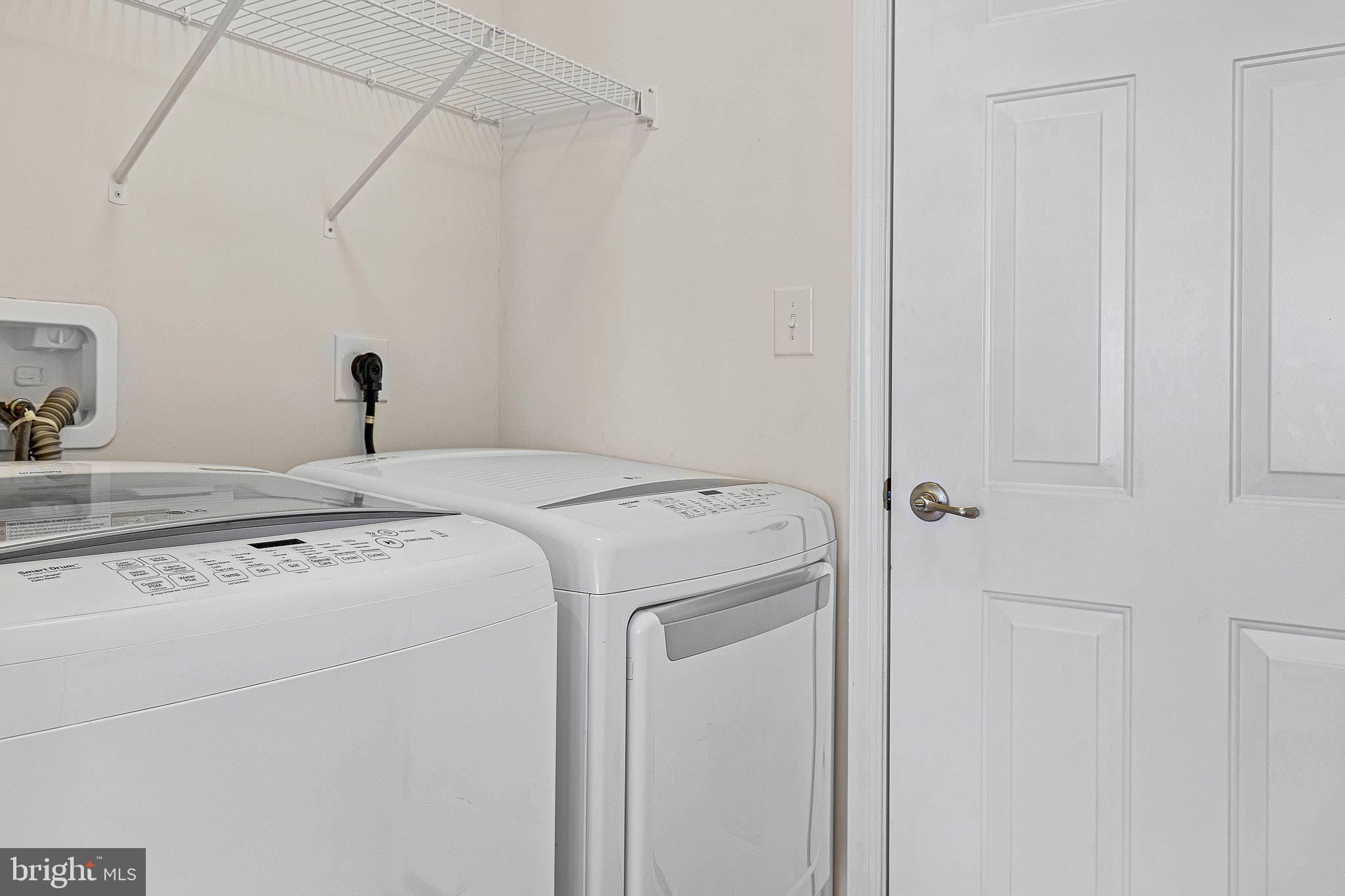 647 Vivaldi Drive Middletown, DE 19709 - Photo 24 of 38 a utility room with dryer and washer
