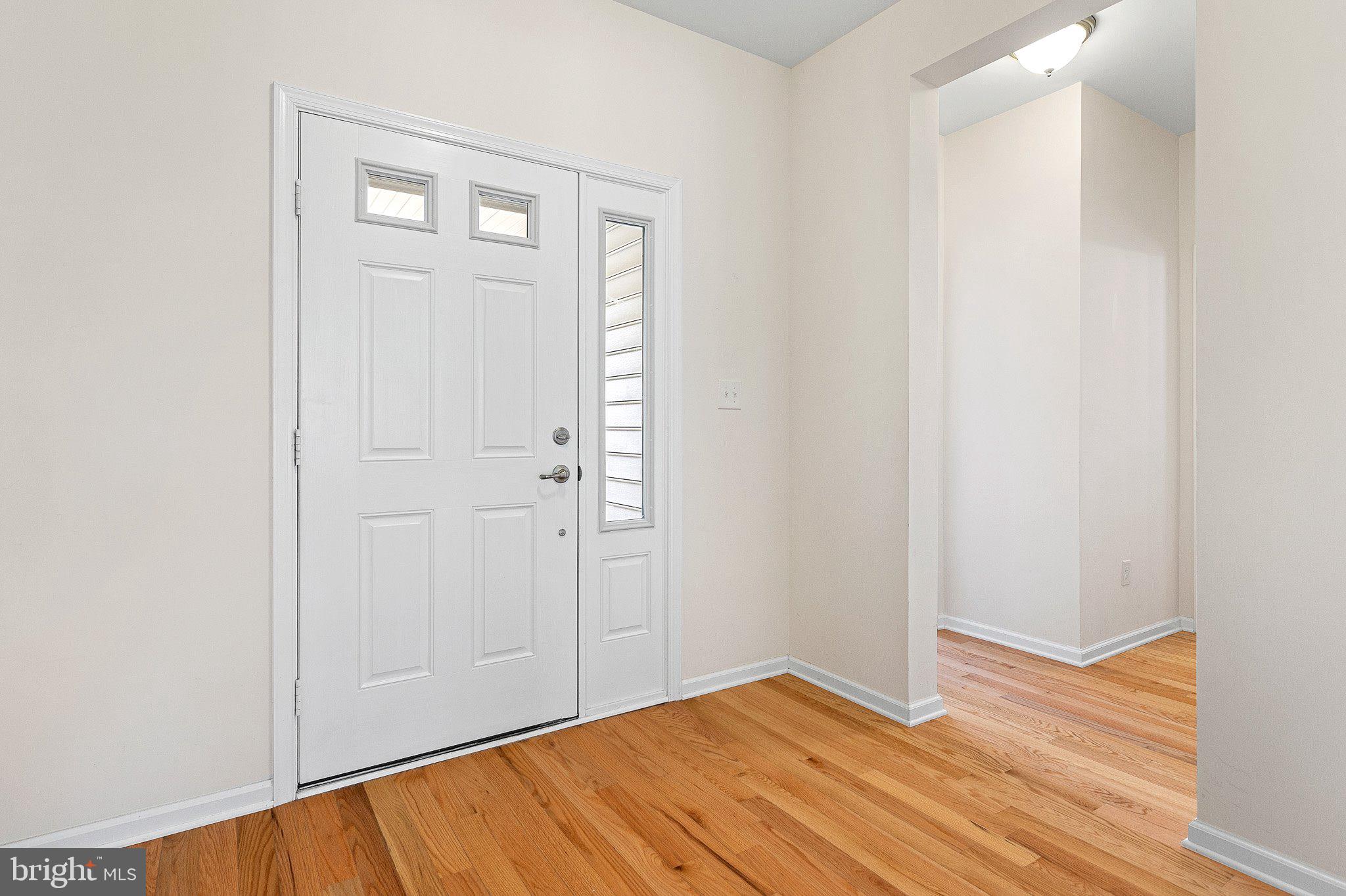 647 Vivaldi Drive Middletown, DE 19709 - Photo 25 of 38 a view of an empty room with wooden floor