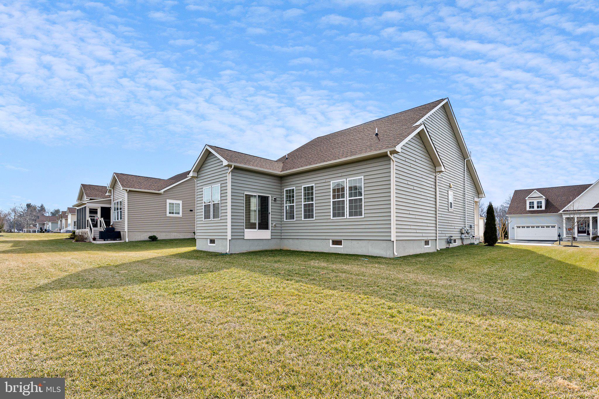 647 Vivaldi Drive Middletown, DE 19709 - Photo 28 of 38 a view of a house with a yard and a garage