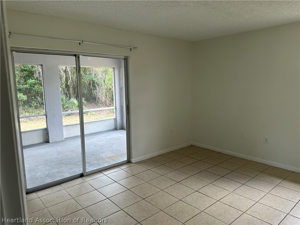 237 Rhapsody Avenue Lake Placid, FL 33852 - Photo 10 of 18 an empty room with windows