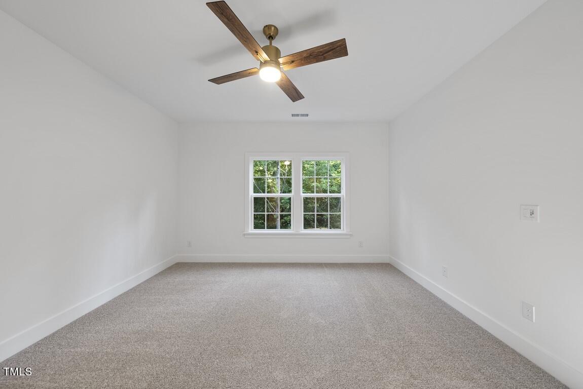 13541 Old Creedmoor Road Wake Forest, NC 27587 - Photo 19 of 41 an empty room with a window