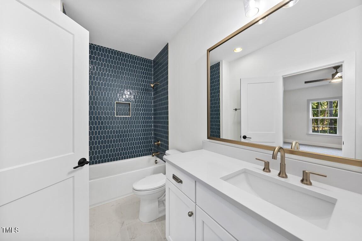 13541 Old Creedmoor Road Wake Forest, NC 27587 - Photo 23 of 41 a bathroom with a sink a toilet and shower