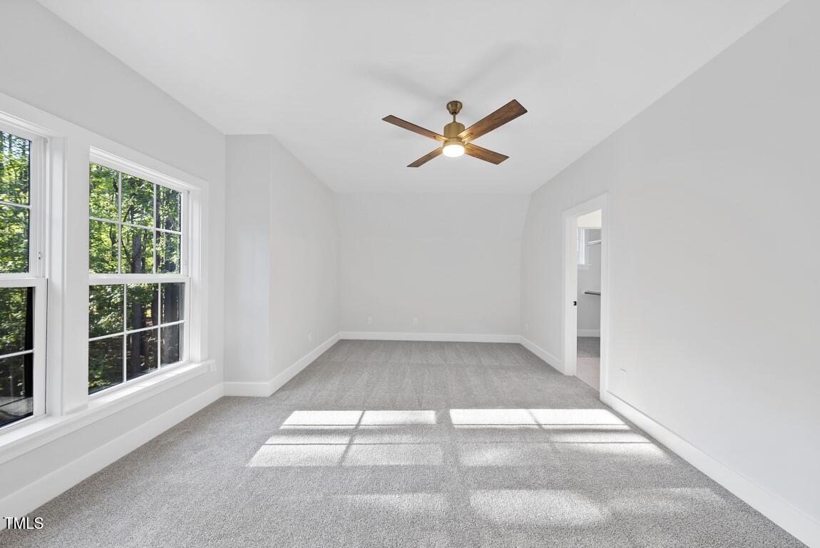 13541 Old Creedmoor Road Wake Forest, NC 27587 - Photo 25 of 41 an empty room with windows and fan