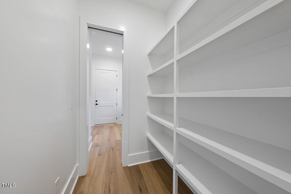 13541 Old Creedmoor Road Wake Forest, NC 27587 - Photo 29 of 41 a view of a hallway with wooden floor and closet