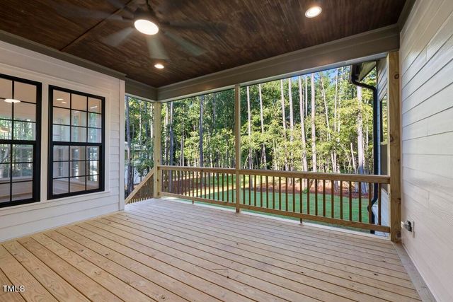 a view of a porch with wooden floor
