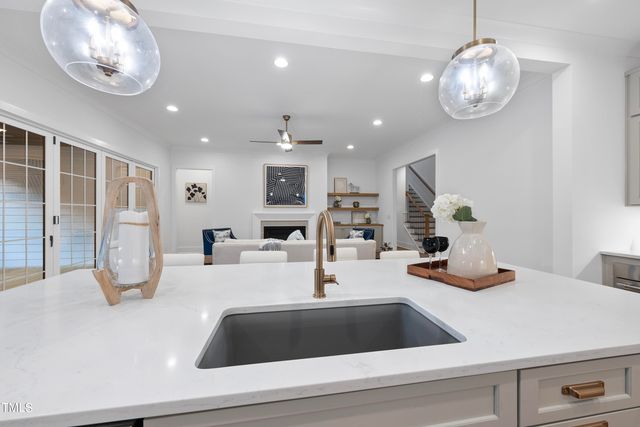 a kitchen with a refrigerator and a sink