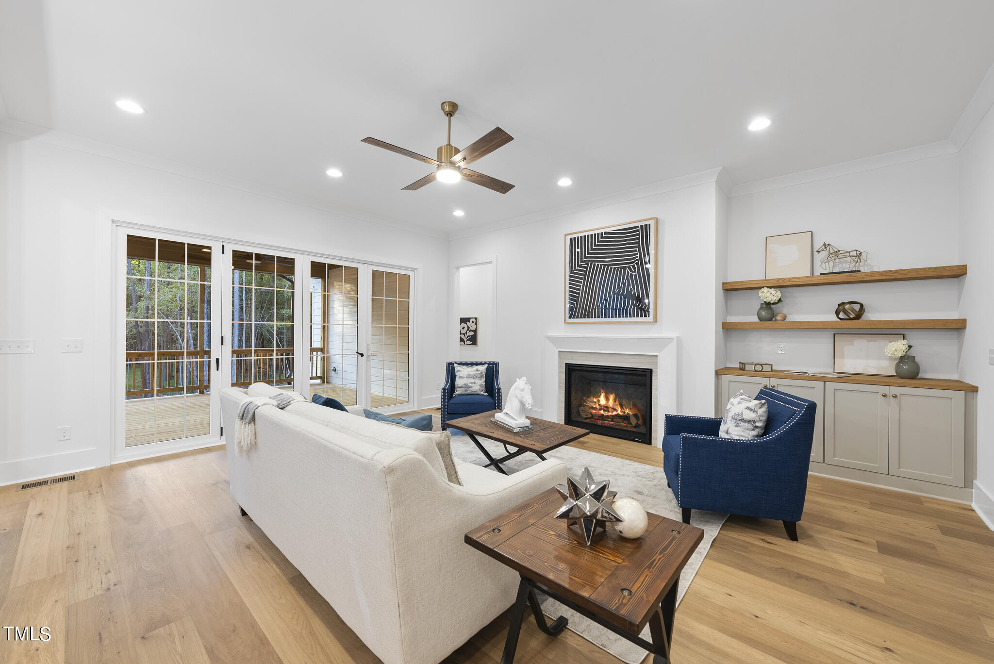 13541 Old Creedmoor Road Wake Forest, NC 27587 - Photo 9 of 41 a living room with furniture and a fireplace