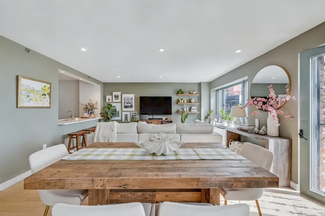 a kitchen with stainless steel appliances granite countertop a refrigerator and a stove