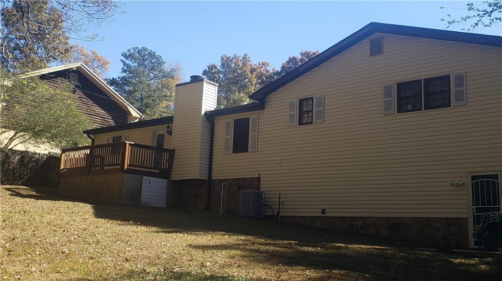 975 Ridgedale Drive Lawrenceville, GA 30043 - Photo 29 of 31 a view of a house with a yard