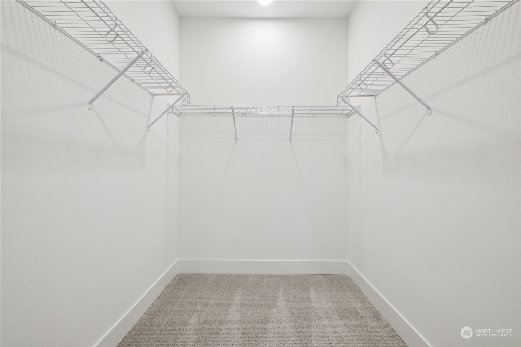 9919 Northeast 189th Street, Unit D Bothell, WA 98011 - Photo 20 of 23 a view of a room with racks on the wall