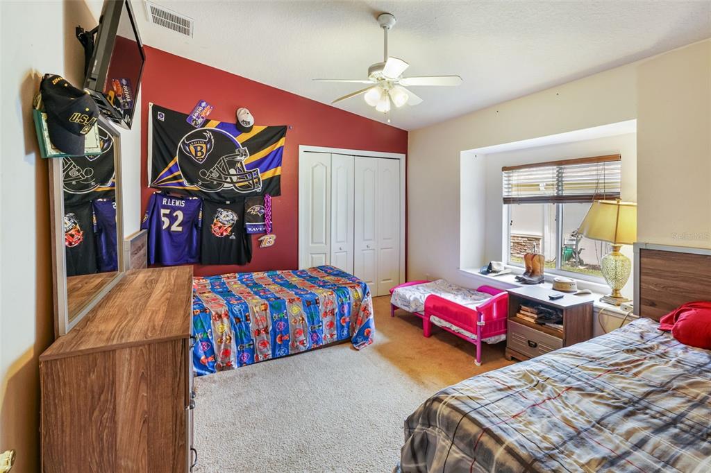 3362 Cedar Crest Loop Spring Hill, FL 34609 - Photo 21 of 57 a bedroom with bed and window