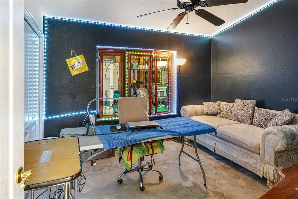3362 Cedar Crest Loop Spring Hill, FL 34609 - Photo 23 of 57 a living room with furniture and a window