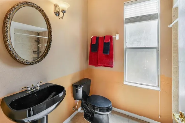 an aerial view of multiple houses with yard