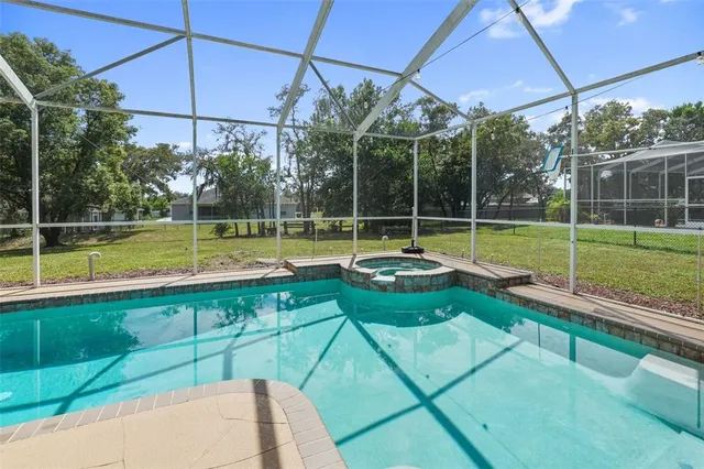 an aerial view of a house with outdoor space