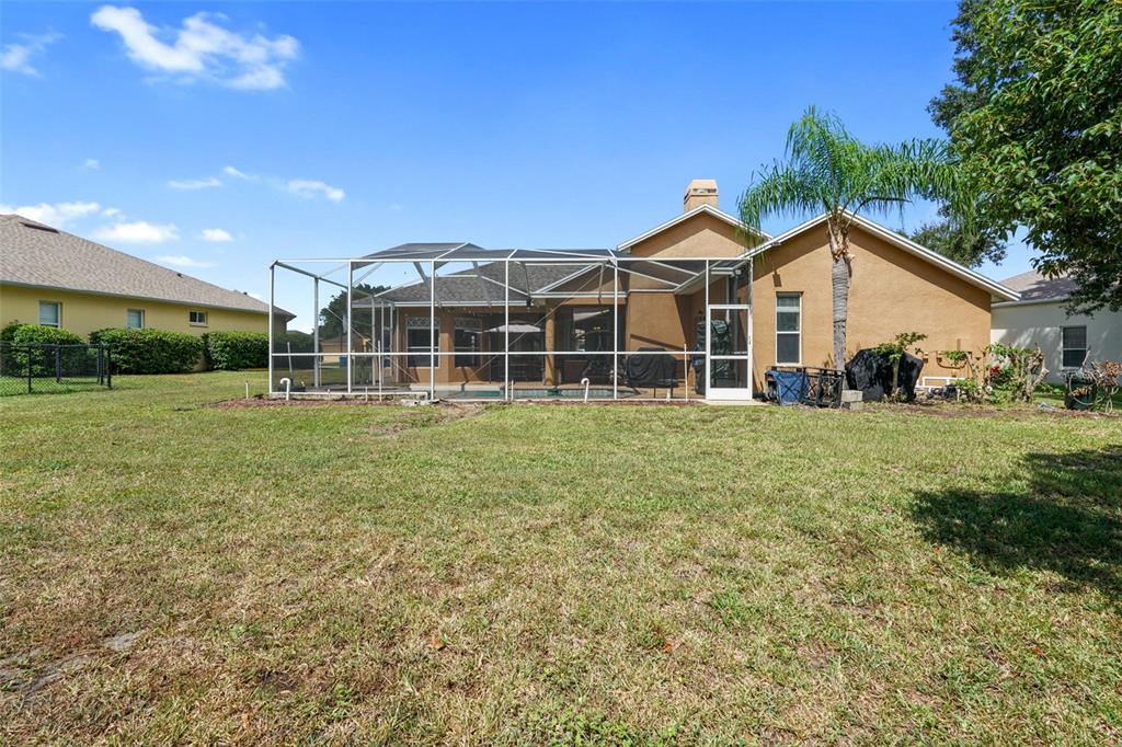 3362 Cedar Crest Loop Spring Hill, FL 34609 - Photo 39 of 57 a front view of a house with a yard