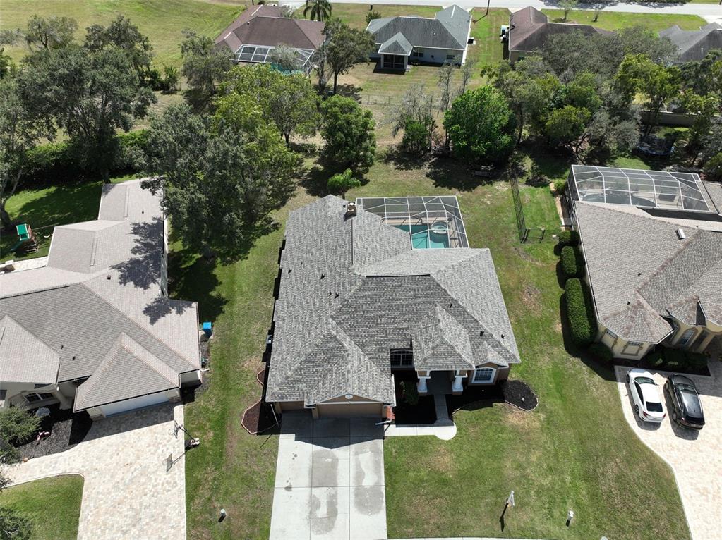 3362 Cedar Crest Loop Spring Hill, FL 34609 - Photo 45 of 57 an aerial view of multiple houses with yard