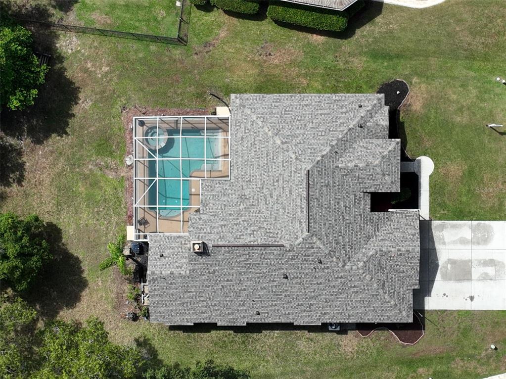 3362 Cedar Crest Loop Spring Hill, FL 34609 - Photo 48 of 57 an aerial view of a house with a yard