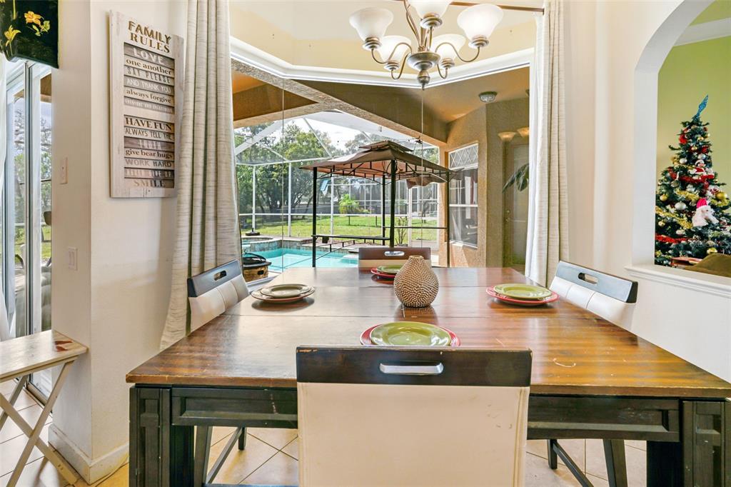3362 Cedar Crest Loop Spring Hill, FL 34609 - Photo 9 of 57 a view of a dining room with furniture window and outside view