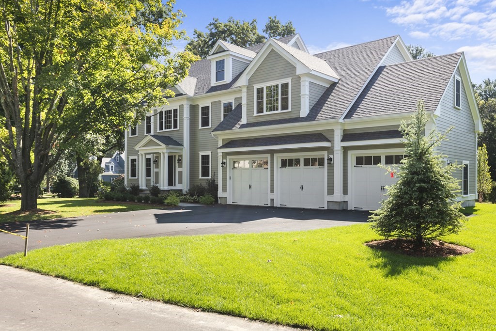 15 Flintlock Road Lexington, MA 02420 - Photo 1 of 36 a view of a white house with a swimming pool and a yard