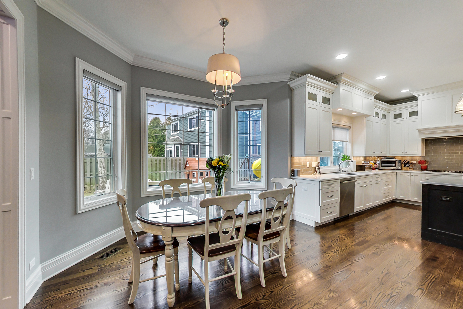 1049 Greentree Avenue Deerfield, IL 60015 - Photo 11 of 37 a view of a dining room with furniture wooden floor and chandelier