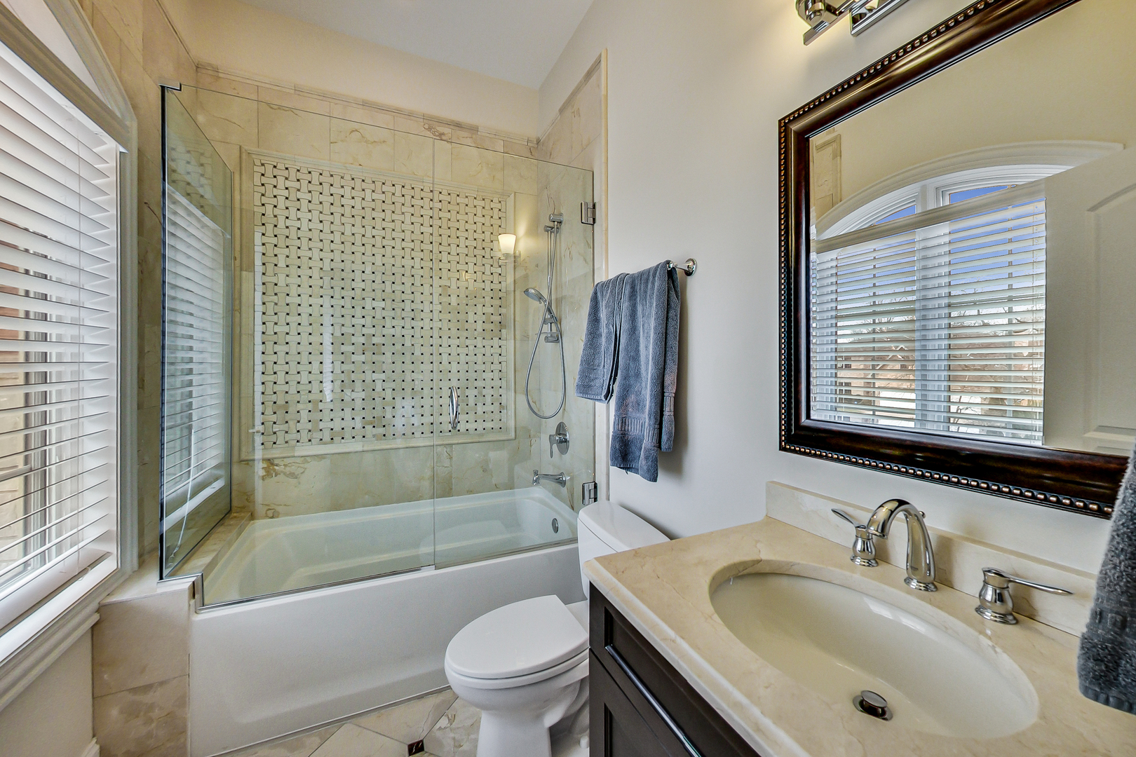 1049 Greentree Avenue Deerfield, IL 60015 - Photo 21 of 37 a bathroom with a sink toilet and shower