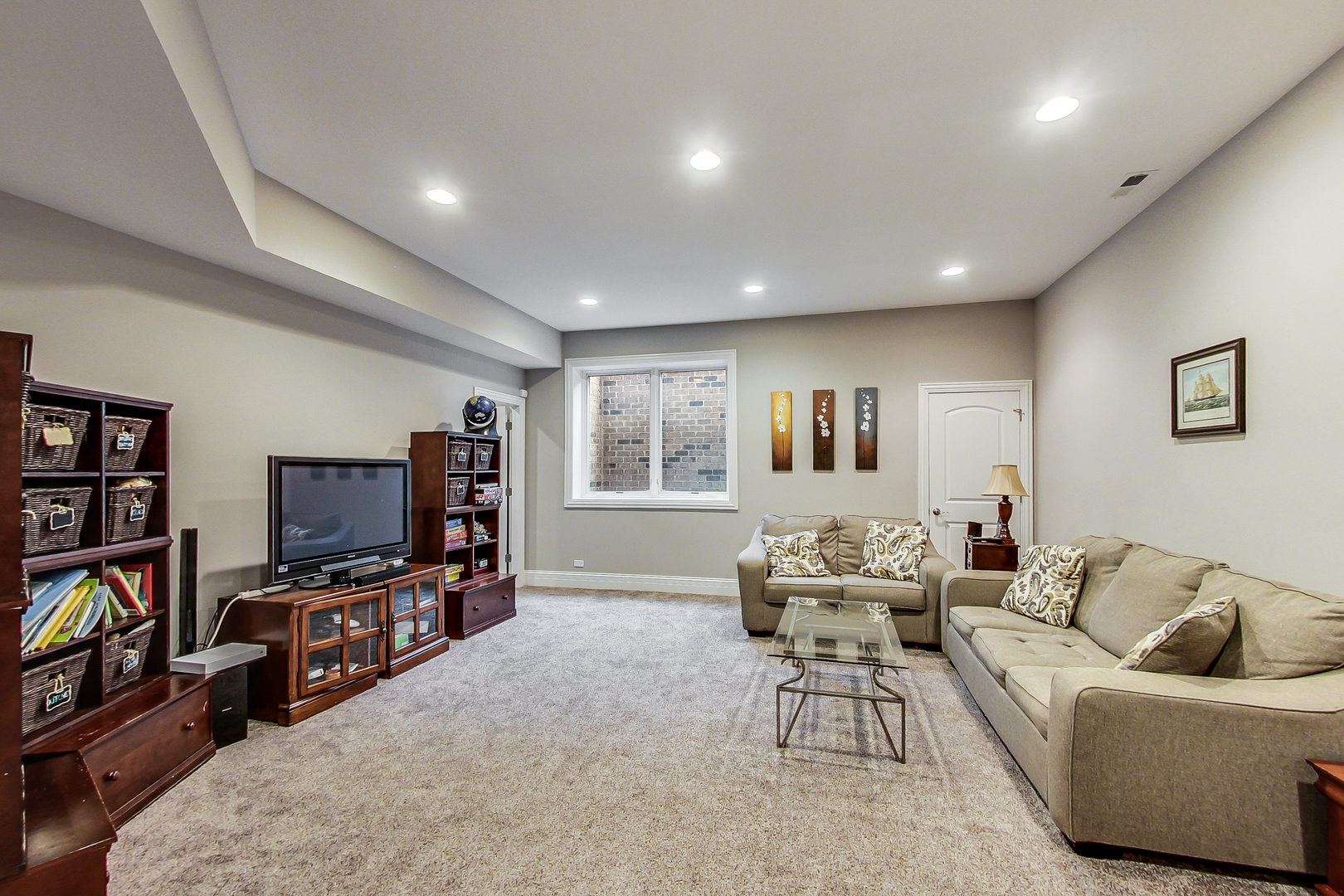 1049 Greentree Avenue Deerfield, IL 60015 - Photo 26 of 37 a living room with furniture and a flat screen tv