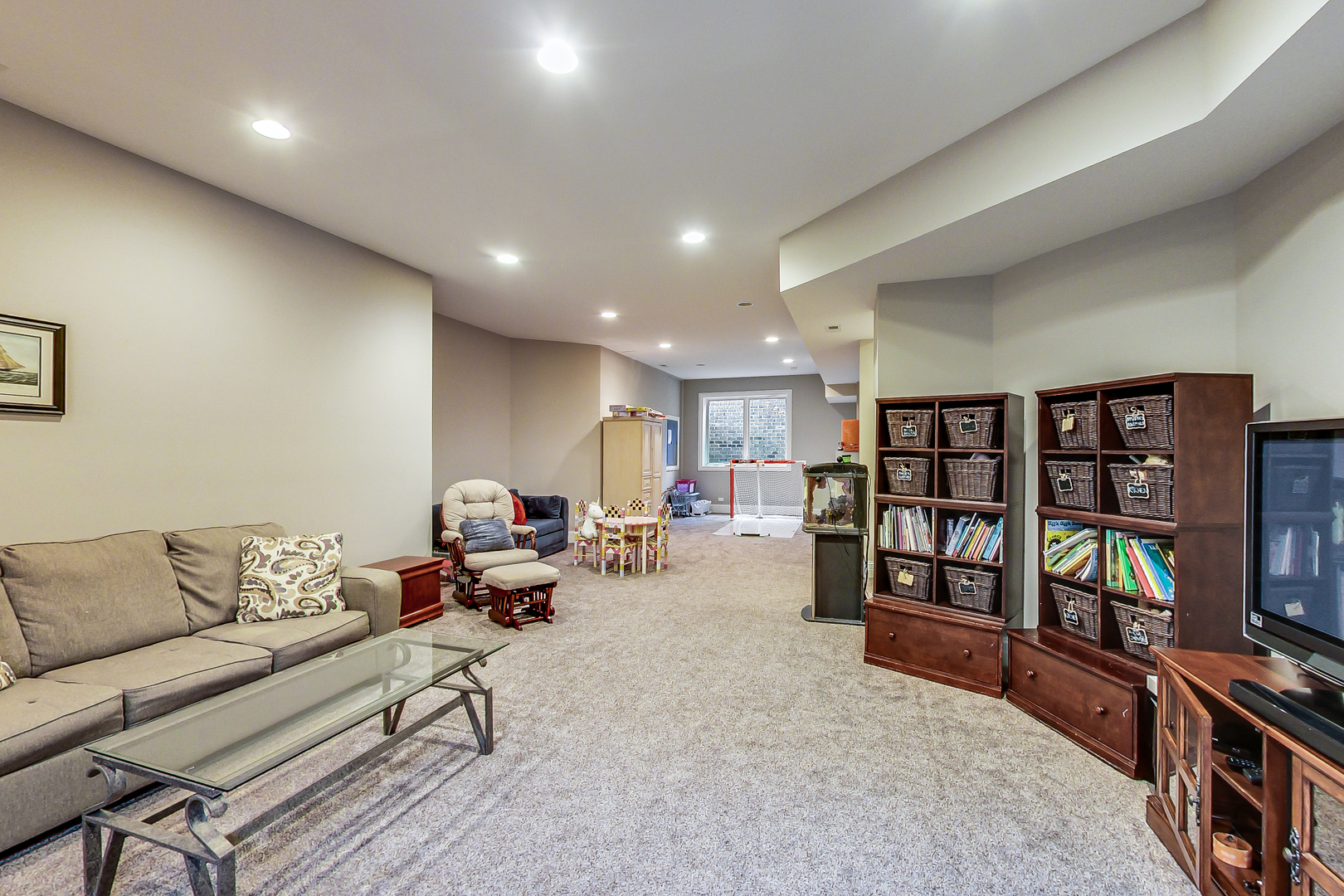 1049 Greentree Avenue Deerfield, IL 60015 - Photo 27 of 37 a living room with furniture and a flat screen tv