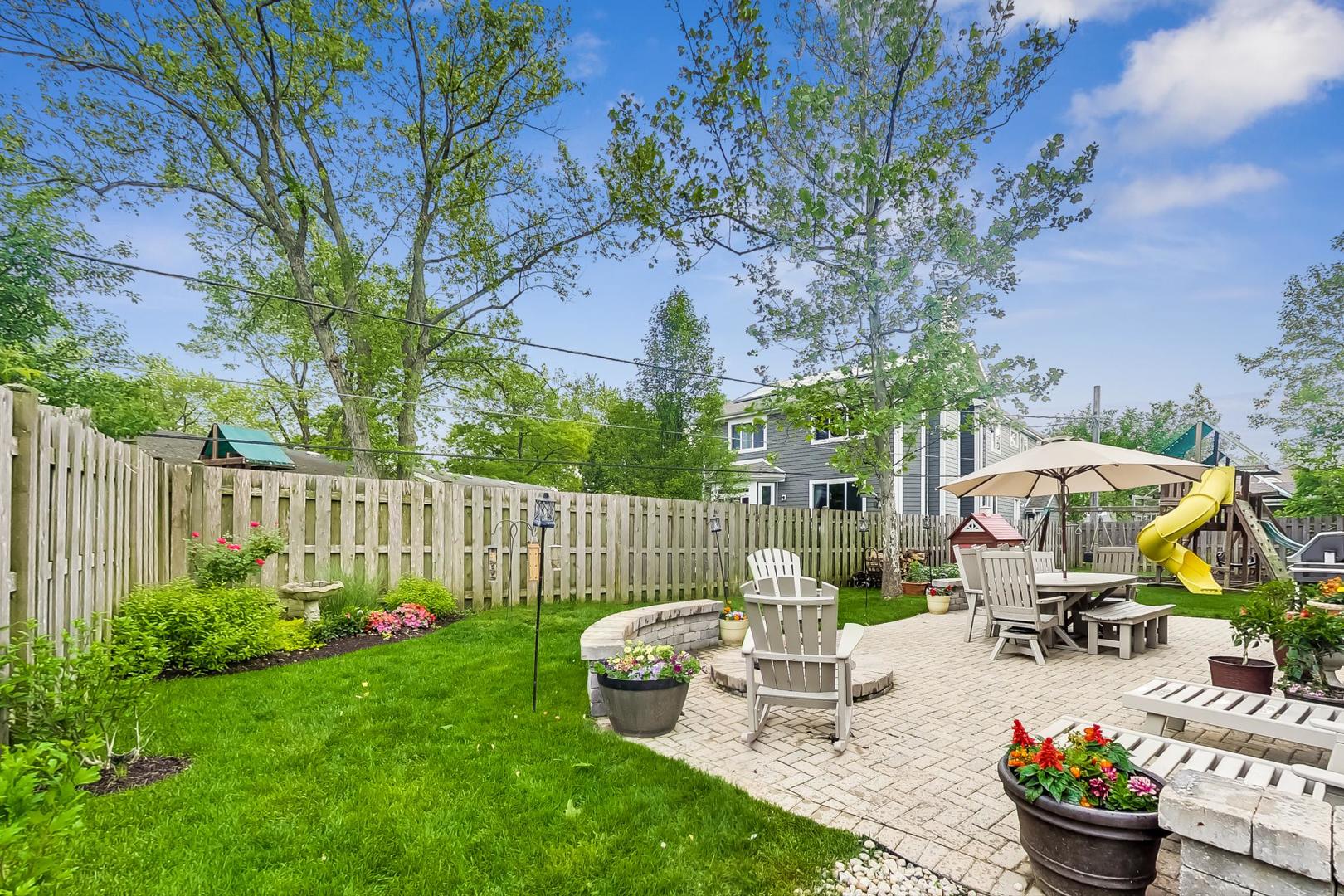 1049 Greentree Avenue Deerfield, IL 60015 - Photo 33 of 37 a view of a backyard with plants and chairs