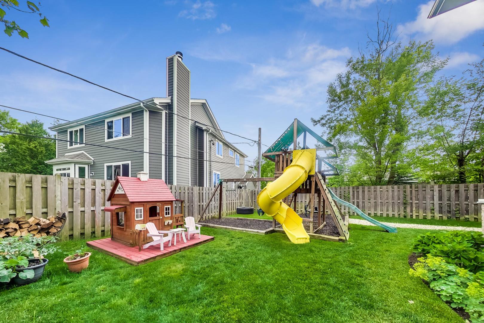 1049 Greentree Avenue Deerfield, IL 60015 - Photo 36 of 37 a view of a house with a backyard and a slide