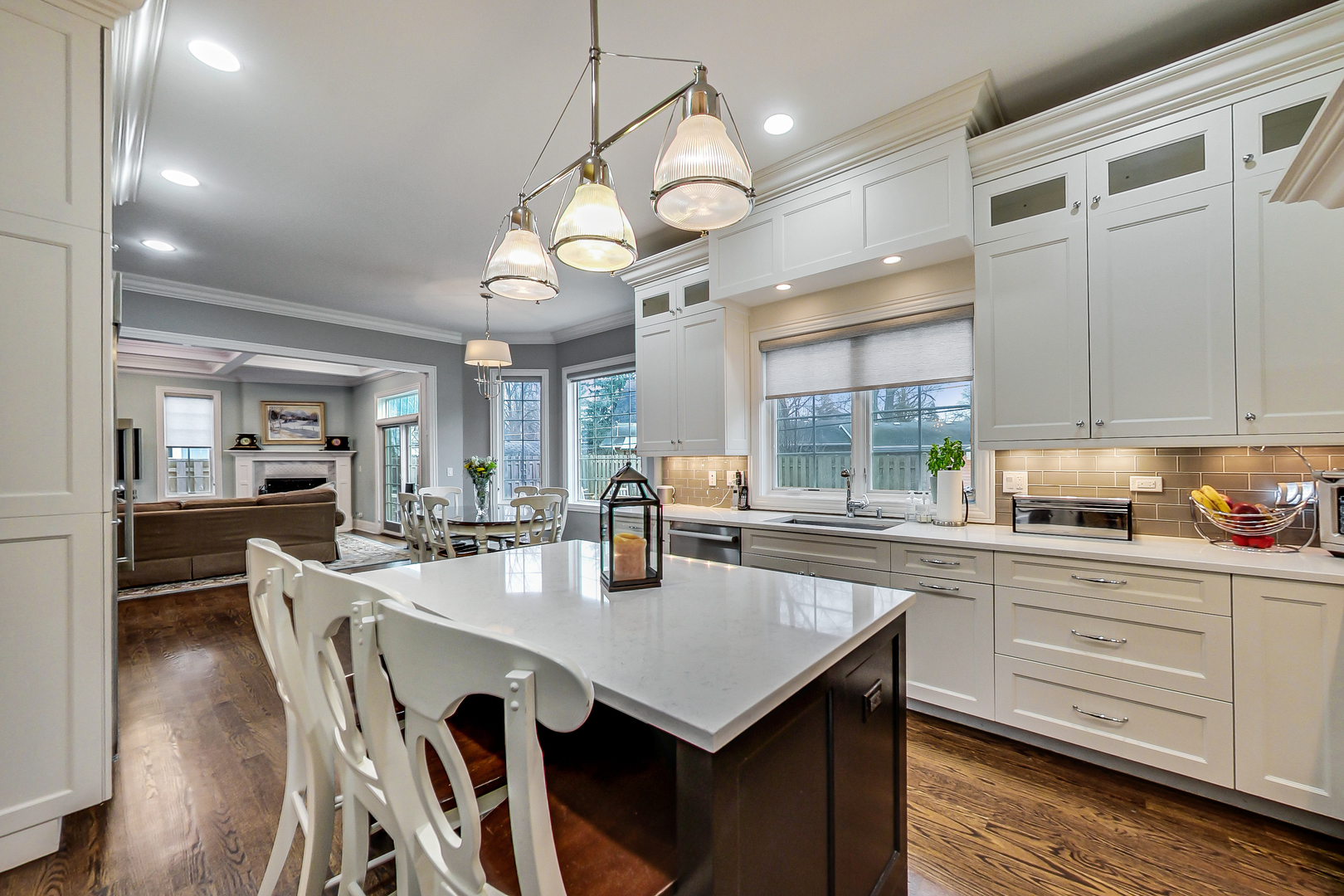 1049 Greentree Avenue Deerfield, IL 60015 - Photo 9 of 37 a kitchen with a dining table chairs cabinets and stainless steel appliances