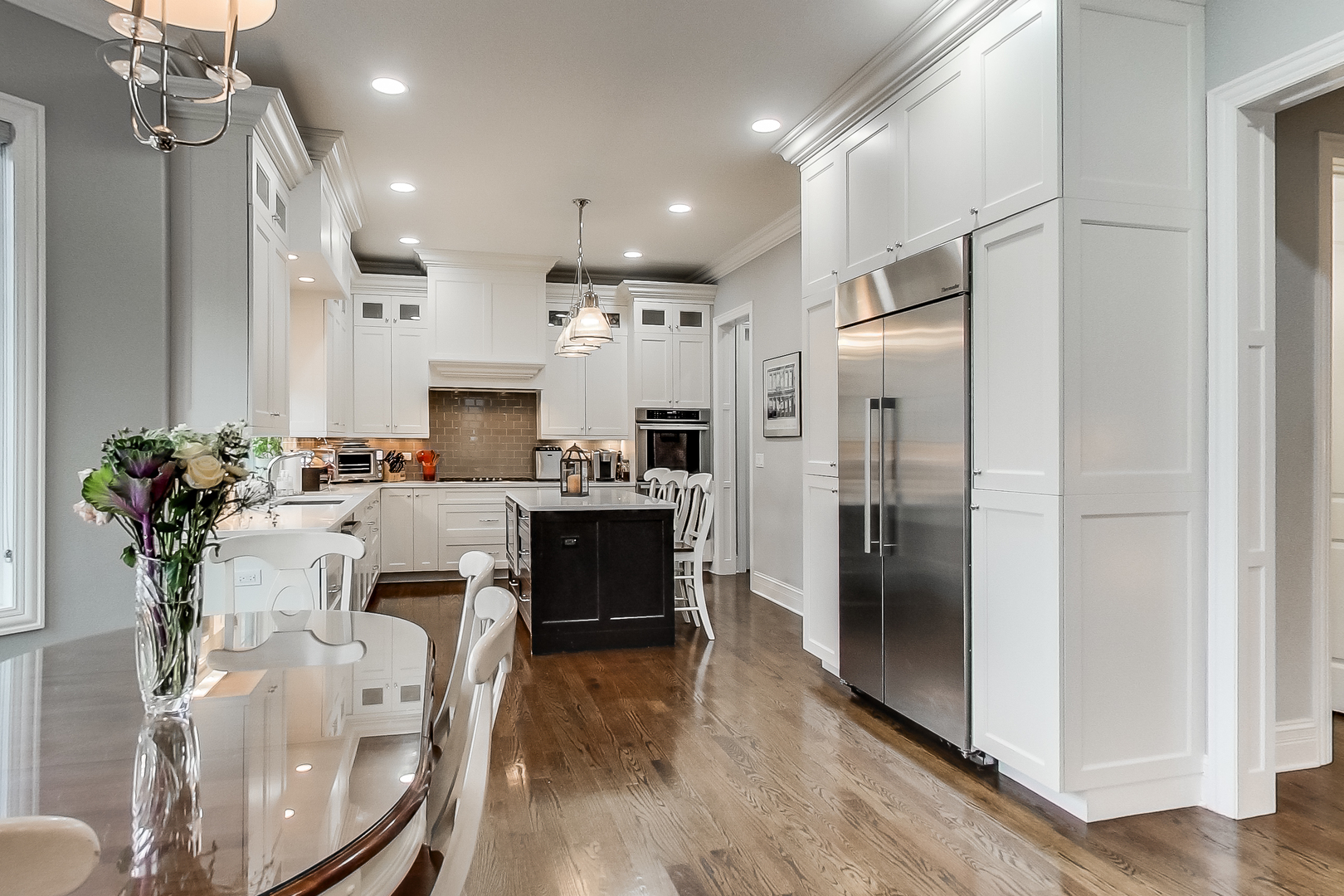 1049 Greentree Avenue Deerfield, IL 60015 - Photo 10 of 37 a view of kitchen with refrigerator stove dining table and chairs