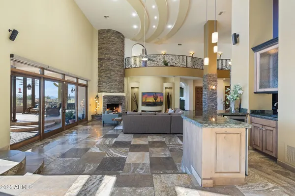 a living room with furniture and a floor to ceiling window