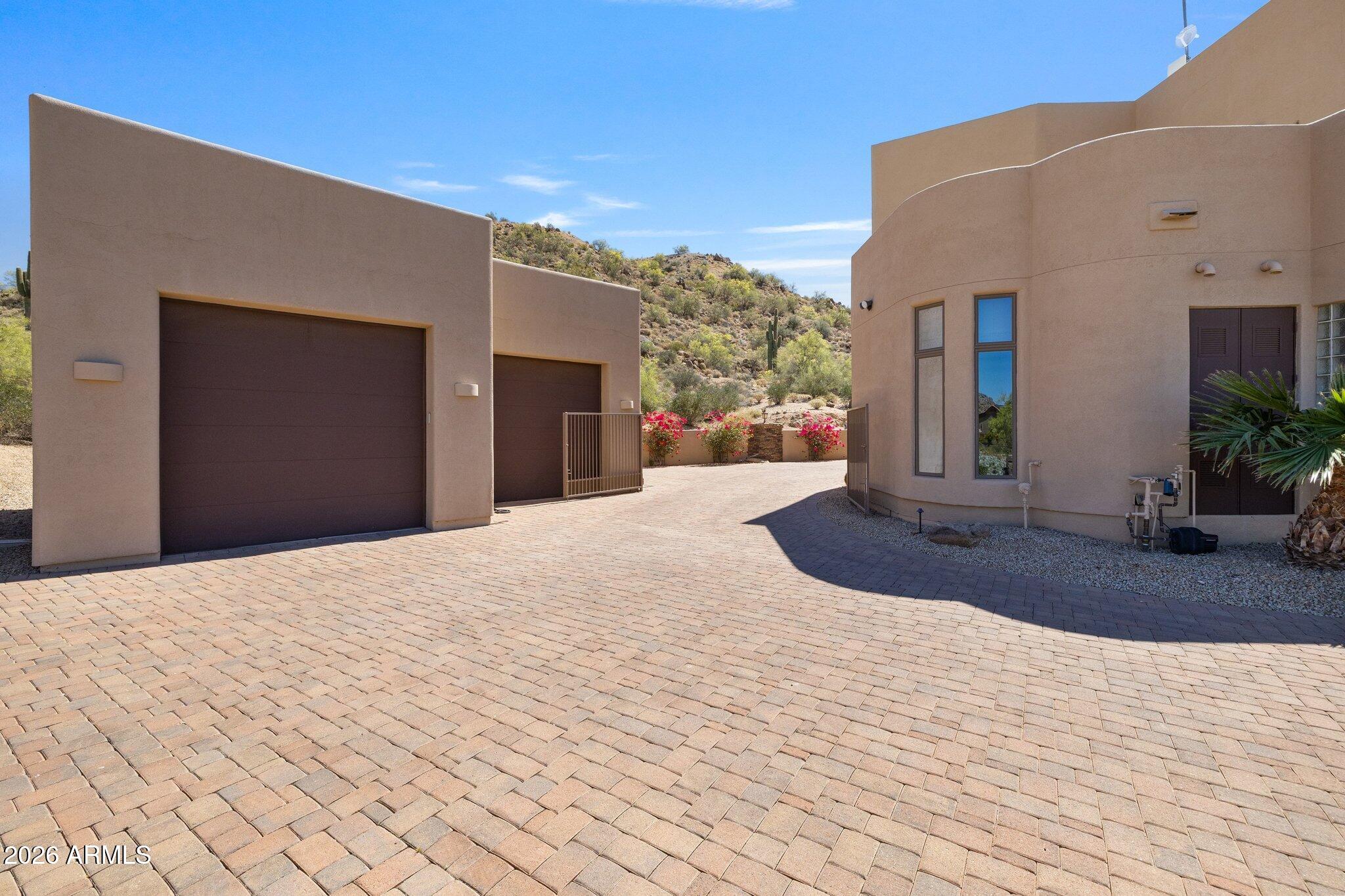 8540 East McDowell Road, Unit 21 Mesa, AZ 85207 - Photo 89 of 121 Garage with Overheight Doors