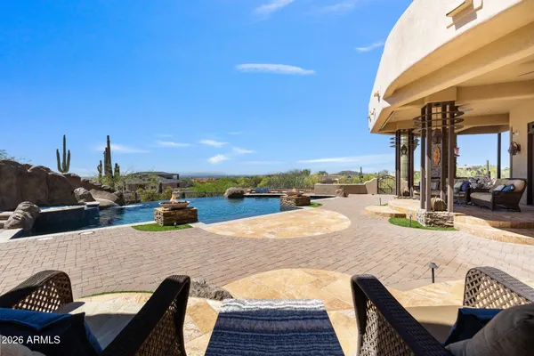 a view of swimming pool with outdoor seating